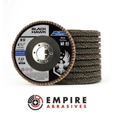 Stack of Black Hawk 4.5-inch zirconia flap discs for grinding and blending metal surfaces, featuring a T29 conical design. Empire Abrasives logo below.