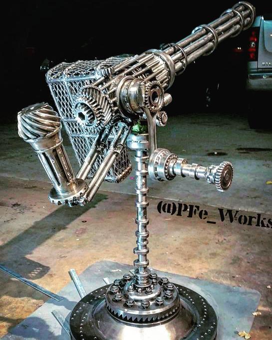 "Population Control" - metal art sculpture of a gatling gun created by metal sculptor PJ Kennedy aka PFe works