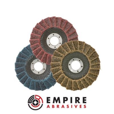 Surface conditioning non-woven flap discs in maroon, blue, and tan colors, used for blending, cleaning, and surface preparation