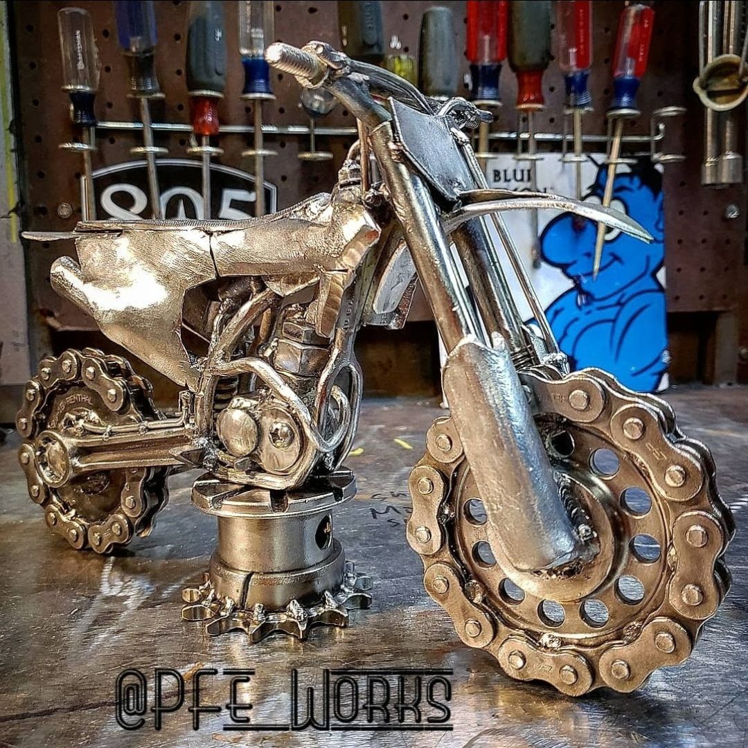 Metal art dirt bike made of scrap metal parts by metal artist PJ Kennedy aka PFe works