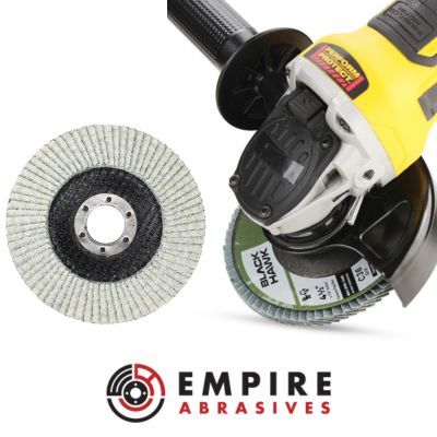 Black Hawk 4.5-inch flap disc mounted on an angle grinder, specifically designed for aluminum and soft metals with a non-loading stearate coating.